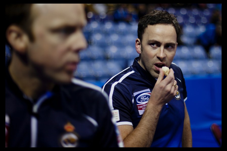 Scotland curling Skip David Murdoch eats a banana