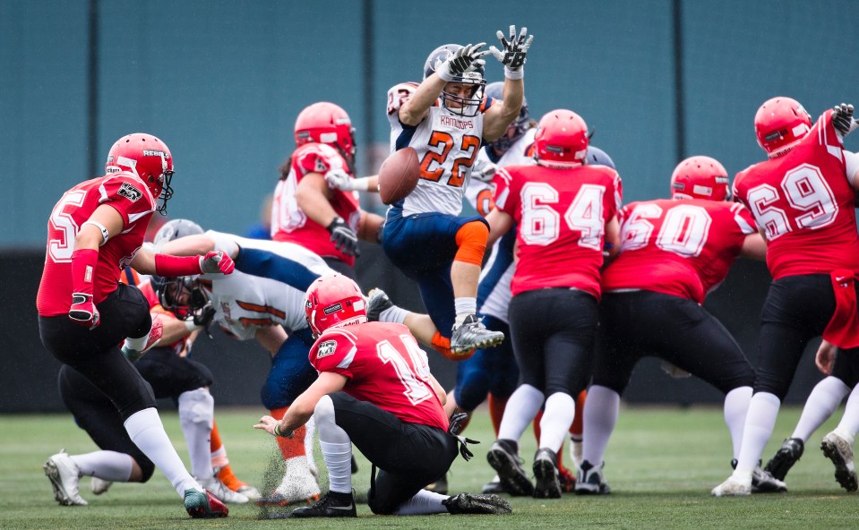 Westshore Rebels Kicker Erikson Deseron has his first quarter field goal attempt blocked by Kamloops Broncos defensive back Derek Trager at Westhills Stadium in Langford B.C. on Saturday August 29, 2015.