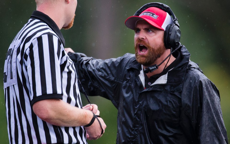 With a six point lead Westshore Rebel head coach JC Boise argues with the official over a time out call during the last minute of the fourth quarter versus the Kamloops Broncos at Westhills Stadium in Langford B.C. on Saturday August 29, 2015.