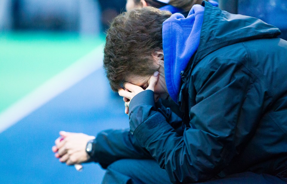 University of Victoria Vike Head Coach Lynne Beecroft can't watch as the University of British Columbia was awarded a short corner with under a minute in the gold medal match of the CIS Women's Field Hockey Championships on November 8th, 2015 in Victoria, British Columbia, Canada. The Thunderbirds would score tying the game at two  and eventually losing 3-2 (3-1 in penalty shots) to the Thunderbirds who claimed their fifth straight McCrae Cup.