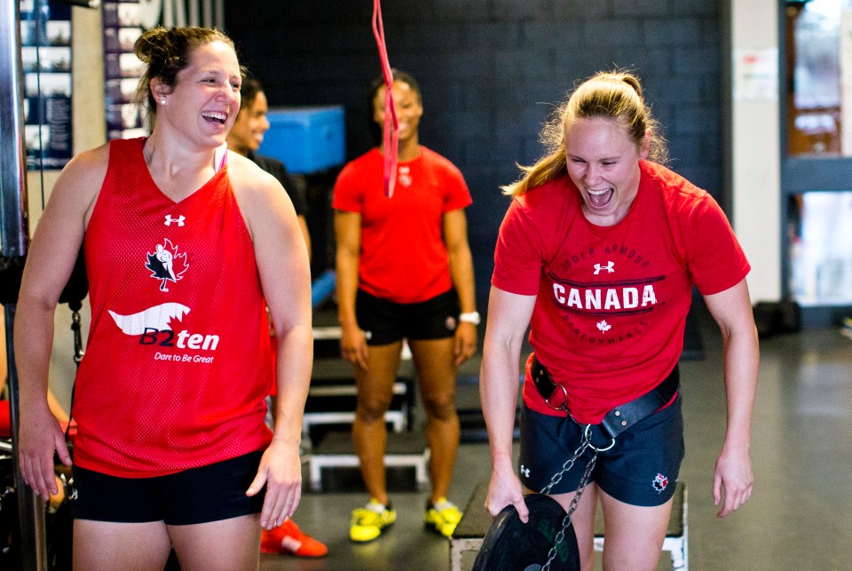 Natasha Watcham-Roy and Karen Paquin share a laugh during a team weight training practice at the Pacific Institute for Sports Excellence in Victoria, British Columbia Canada on January 25, 2016. (Kevin Light/CBCSports)