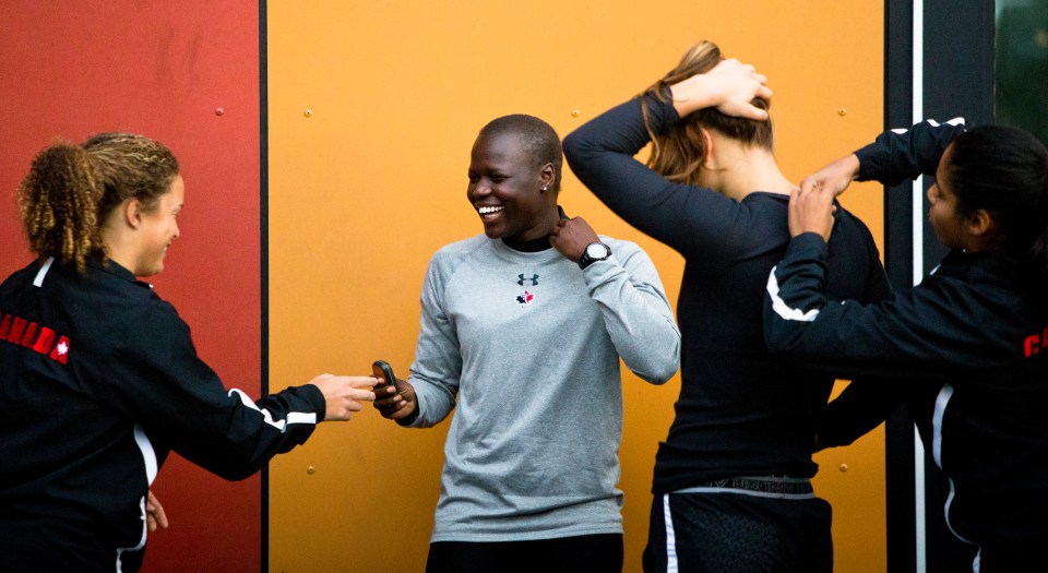 Emmanuela Jada puts on her GPS tracking device prior to the start of a team practice at the Pacific Institute for Sports Excellence in Victoria, British Columbia Canada on January 25, 2016. (Kevin Light/CBCSports)